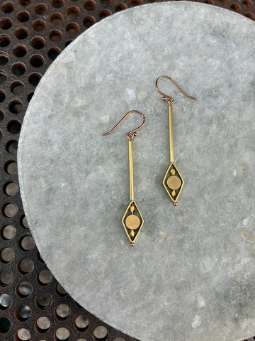 Kinetic circle drop earrings with diamond frame