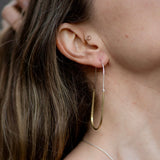 Hand-formed hammered brass and sterling hoops
